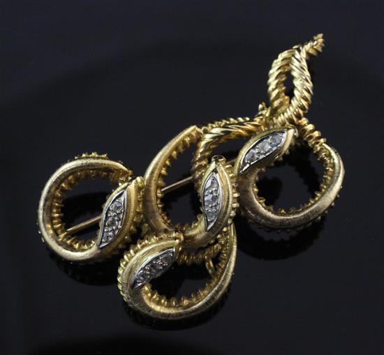 An 18ct gold and diamond brooch, modelled as four entwined serpents, 2in.